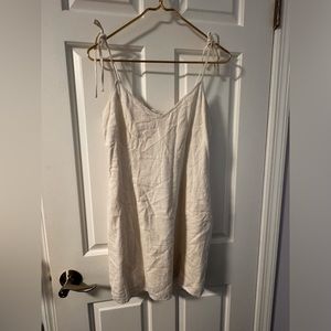 White tie dress with small cut out at bottom